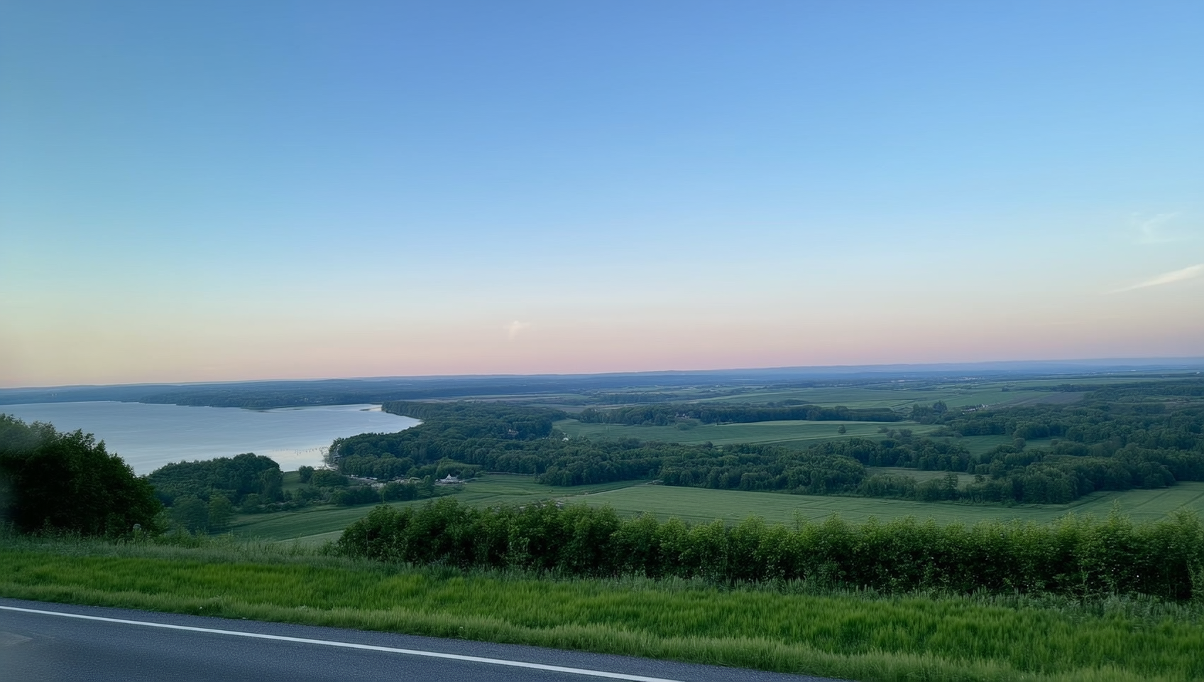 Alliston farmland under a soft blue sky with rolling fields fading into dusk